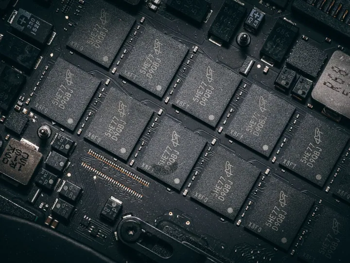 Close view of chips and components on an electronic circuit board.