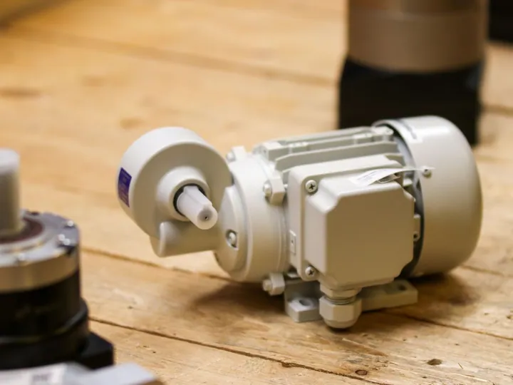 White electric motor on a workshop table.