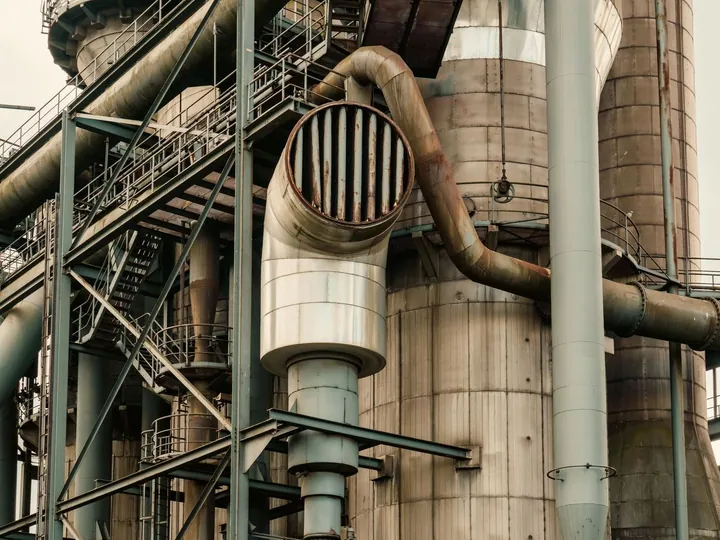 Pipes and steel structures at an industrial plant.
